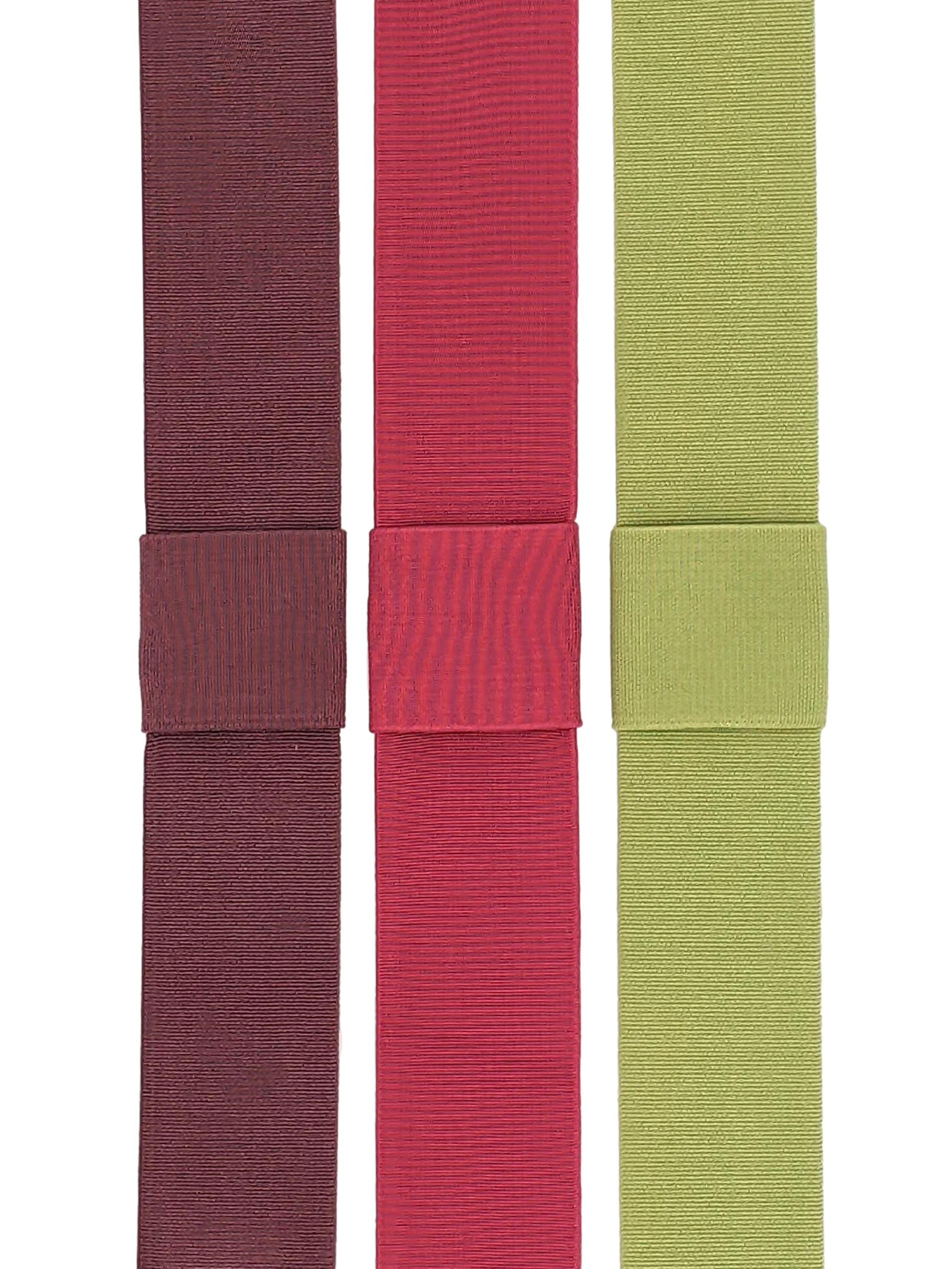 Three interchangeable elastic hat bands in mauve, magenta pink, and pistachio green colors, displayed side by side.