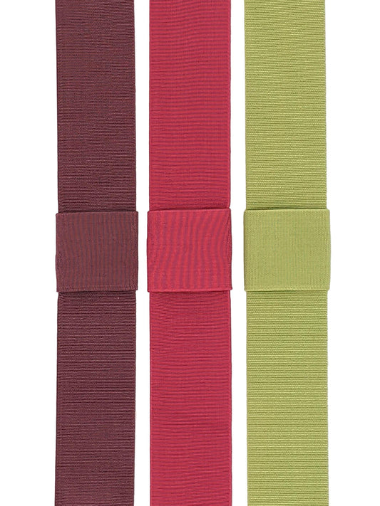 Three interchangeable elastic hat bands in mauve, magenta pink, and pistachio green colors, displayed side by side.