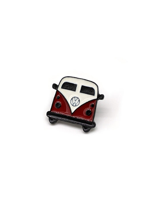 A brooch designed in the shape of a Volkswagen Camper van, intended to be attached to a hat.